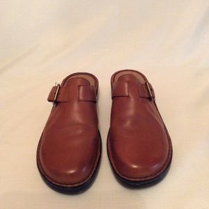 Naturalized saddle brown slip clogs,